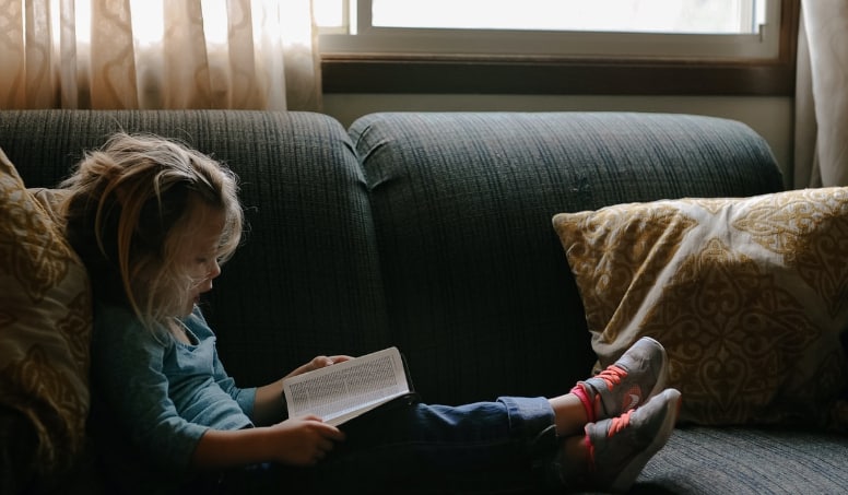 Child Reading A Book