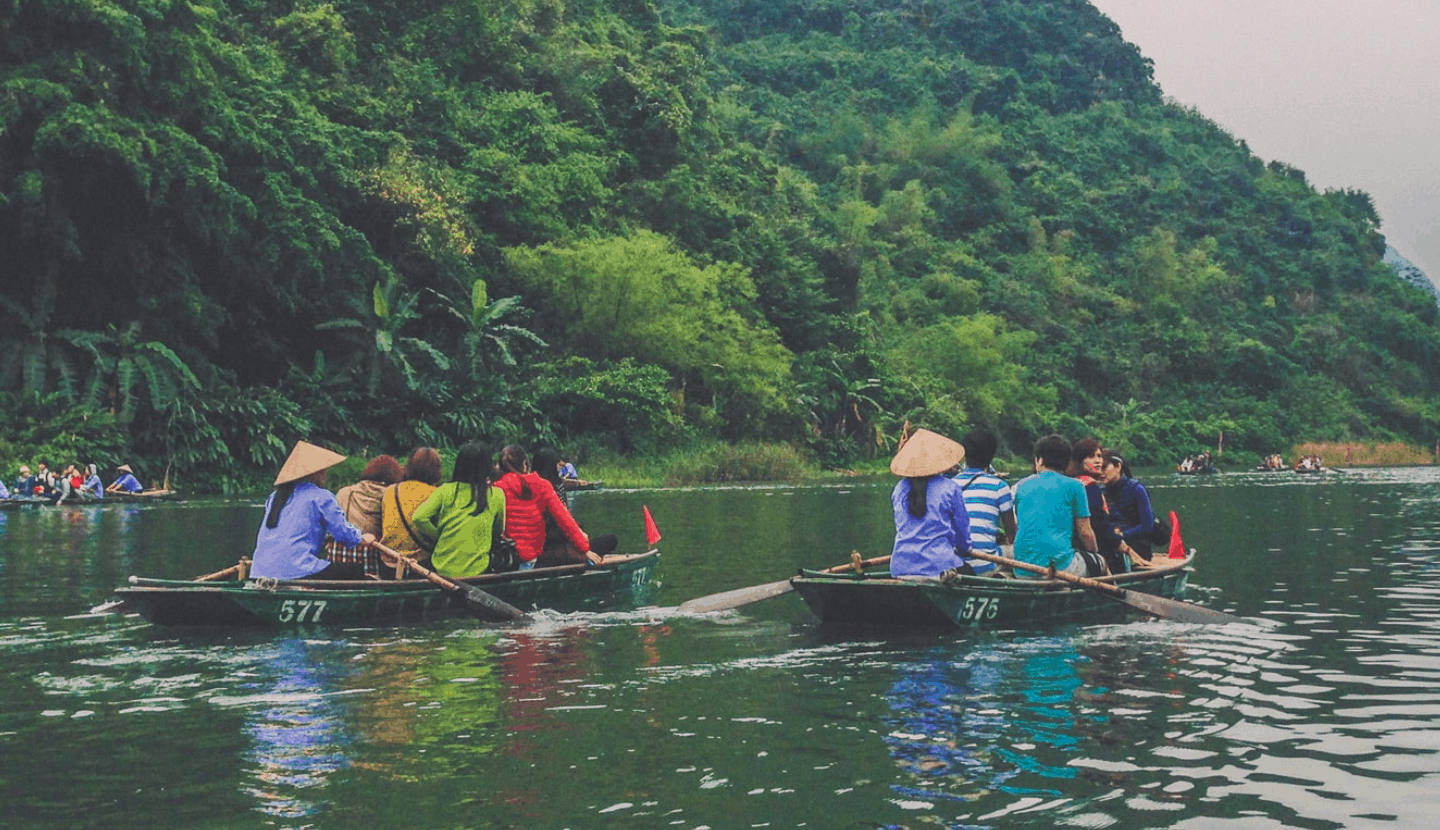 A Group Of People On Tour In A Boat